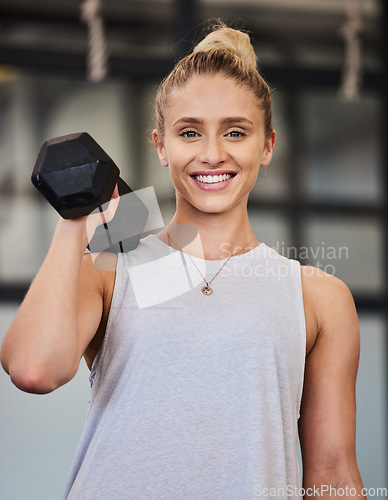 Image of Happy woman, dumbbell and portrait of a athlete with a smile ready for training, exercise and workout. Sports gym, happiness and young person bodybuilder in a health, wellness and sport center