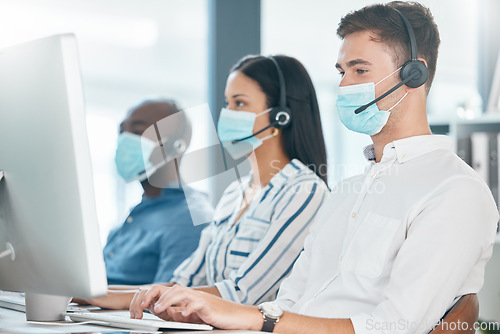 Image of Covid, health and call center employees with face mask, safety and protection against virus with job healthcare compliance. Customer service, CRM and contact us with phone call, corona and diversity