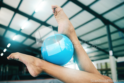 Image of Feet, gymnastics and woman with ball for competition, practice or event training. Closeup, sports and barefoot female gymnast balance equipment with agility, exercise and performance in olympic arena