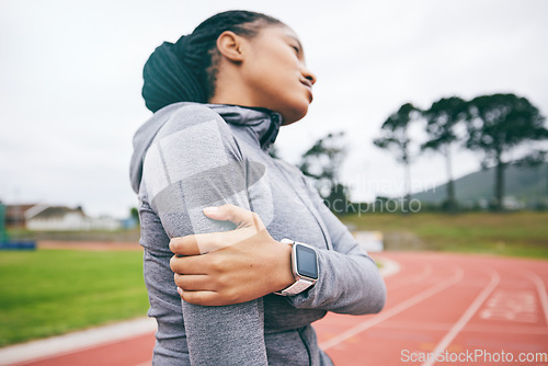 Image of Black woman, arm pain and injury after exercise, workout or training accident at stadium. Winter sports, fitness and female athlete with fibromyalgia, inflammation or painful muscles after running