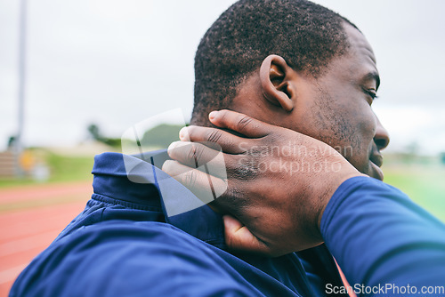 Image of Black man, neck pain and injury after exercise, workout or training accident at stadium. Winter sports, fitness and male athlete with fibromyalgia, inflammation and painful muscles after running.