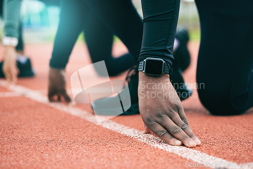 Image of Athlete, runner and fitness person at start of a race on a sports track for exercise, workout or motivation. Running, sprint and closeup of man ready for training as wellness, competition and health