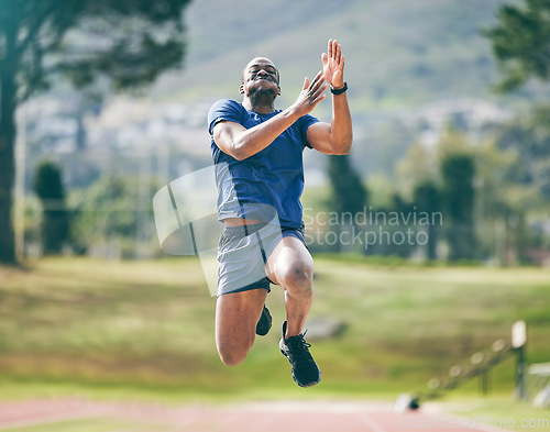 Image of Black man, high jump and fitness exercise at stadium for training, workout or practice. Sports, wellness and male athlete exercising and jumping for performance, endurance and competition outdoors.