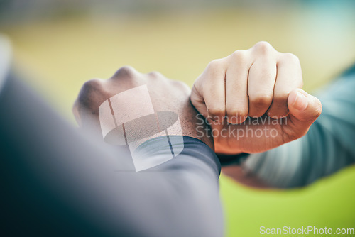 Image of Hands, fist bump and sports teamwork for motivation, collaboration and success. Team building, support and people, man and woman together for workout, training targets and exercise goals outdoors.