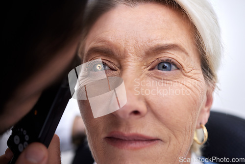 Image of Woman, face and eye exam lamp for medical glasses, prescription lens or mature glaucoma disease. Zoom, optician and optometry patient in test, ophthalmologist consulting or healthcare wellness vision