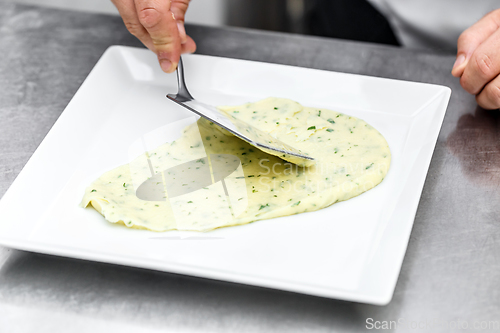 Image of Chef add mashed potatoes on plate
