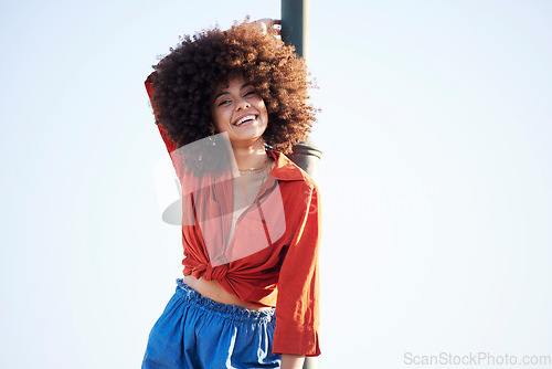 Image of Woman, happy and outdoor portrait for fashion on a blue sky background with summer mock up space. Face of beauty model person with natural hair, happiness and unique style for freedom mindset