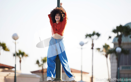 Image of Fashion, dancer and black woman in urban city with energy, excited and freedom of gen z youth in streetwear. Natural hair, afro and young person or model in trendy clothes for outdoor hip hop style