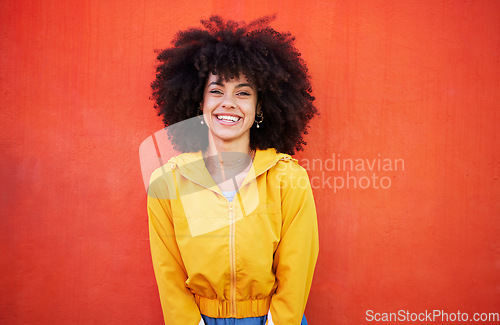 Image of Portrait of happy woman with natural hairstyle on red background, headshot of model and red copy space. Confident young person with smile expression, curly hair and aesthetic fashion on studio wall