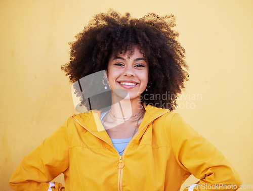 Image of Portrait, fashion and happy with an afro black woman in studio on a yellow background for style. Trendy, hair and smile with an attractive young female posing alone on product placement space