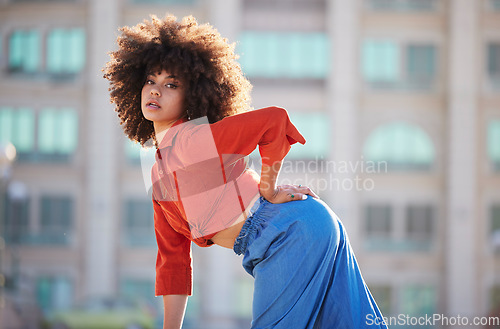 Image of Black woman, fashion and beauty with portrait in city in street style, travel and natural hair, trendy and edgy. Streetwear, stylish and urban mockup, person posing in cityscape and designer clothes