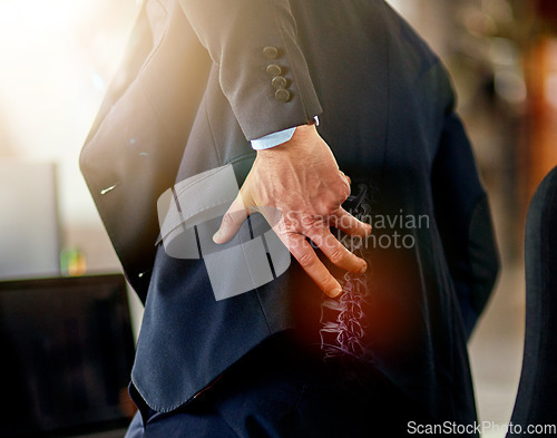 Image of Businessman, hand and back pain from work injury, accident or bad posture in x ray at the office. Hands of male employee touching painful area, spine or ache in strain, bruise or broken spinal bone