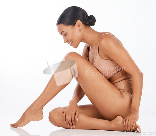 Image of Legs, body and black woman isolated on a white background for beauty, aesthetic or skincare. Model or person in underwear on floor for dermatology, epilation or hair removal results on studio mockup