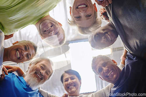Image of Senior exercise group, teamwork circle and low angle portrait with smile, diversity and support for health. Elderly fitness, team building and solidarity for happiness, hug or motivation for wellness