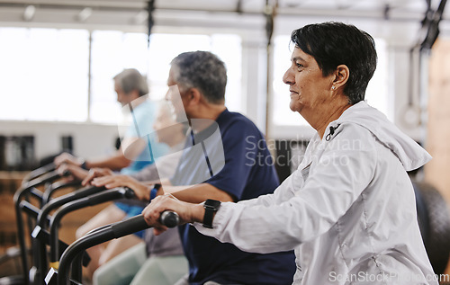 Image of Senior workout group, exercise bike and cycling for fitness, health and retirement wellness by blurred background. Elderly teamwork, bicycle training and diversity with solidarity, focus and goals