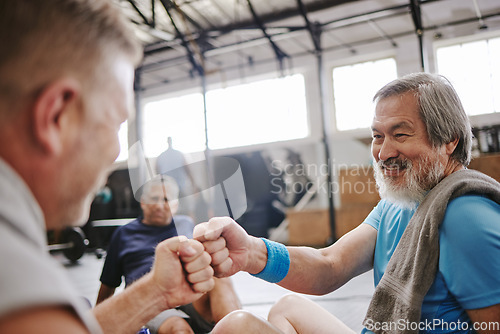 Image of Fitness, gym and men with fist bump for senior support, personal trainer goals and exercise progress. Japanese or asian elderly person with teamwork, achievement and success hand sign for training