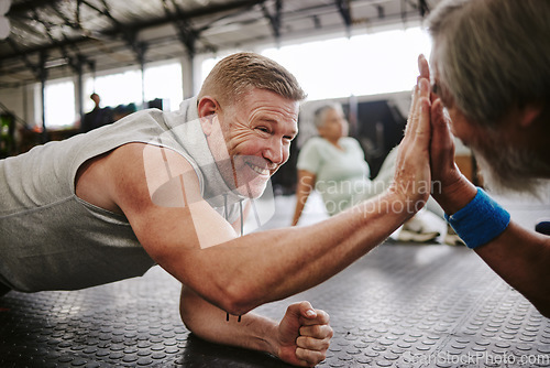 Image of Exercise, old men on floor and high five for achievement, fitness goals or happiness in gym. Mature male athletes, senior citizens or gesture for celebration, workout target or on ground for training