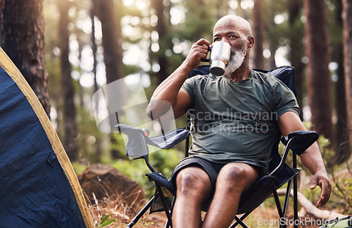 Image of Camping, hiking and coffee with a senior black man in the forest enjoying a drink during retirement. Nature, relax and wellness with an elderly male drinking a beverage in the woods on a hike