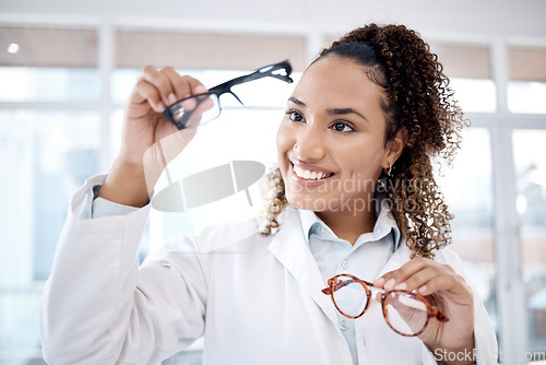 Image of Eye care, vision and black woman, glasses choice and optometrist, healthcare for eyes with doctor and smile. Prescription lens, designer frame and eyewear decision, health insurance and optometry