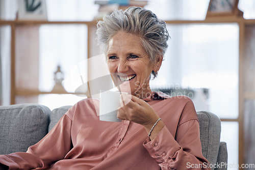 Image of Senior woman, couch and coffee to relax with funny, comic or happy me time for smile in house lounge. Elderly lady, sofa and tea with happiness in home living room in retirement with crazy laughing