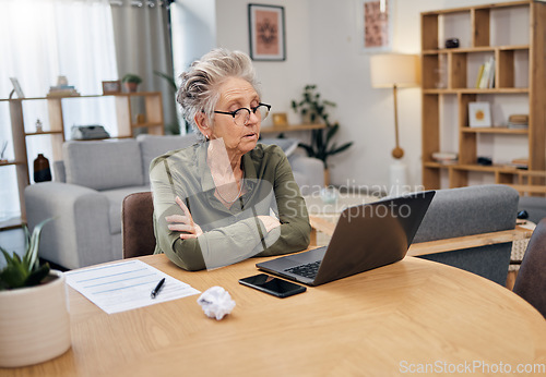 Image of Senior woman, online debt and computer of an elderly person planning retirement savings. Digital budget, paperwork and laptop of an old female reading financial, banking and insurance data or bills