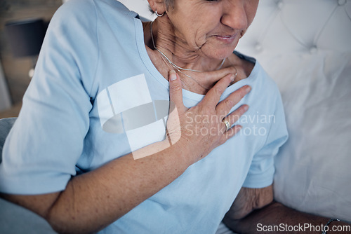 Image of Health, old woman in bed and chest pain in the morning, discomfort and emergency for illness. Medical, mature female and elderly lady in bedroom, heart attack and panic attack with hand touching body