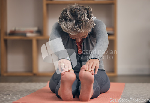 Image of Elderly woman, yoga stretching and home on floor for wellness, health and fitness of body in retirement. Senior lady, workout and training on in living room for healthy muscle, legs and calm mindset