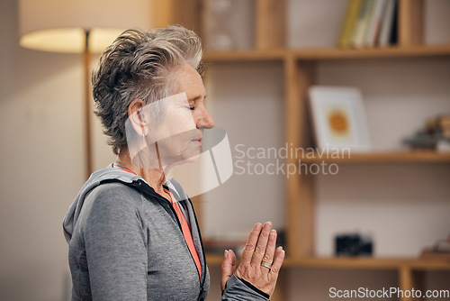 Image of Senior woman, yoga and calm meditation in spiritual wellness for zen, exercise or peaceful at home. Elderly female meditating practice in relax for healthy fitness, awareness or stress relief indoors