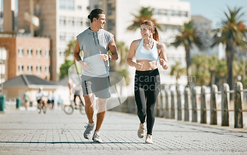 Image of Couple, running and training together in the city for exercise, workout or cardio routine in Cape Town. Happy man and woman runner in fitness, walk or jog for healthy wellness or exercising outside