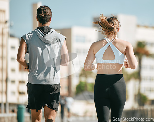 Image of Couple, fitness and running back together in the city for exercise, workout or cardio routine in Cape Town. Active man and woman runner taking a walk or jog for healthy wellness or exercising outside