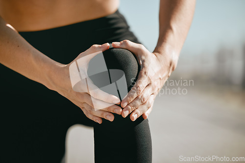 Image of Injury, pain and hand holding knee while running, exercise accident and leg problem while training. Fitness, emergency and woman with a muscle strain, ligament sprain and body spasm during a workout