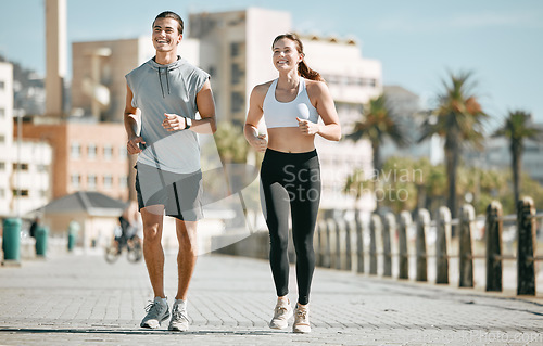 Image of Couple, fitness and running together in the city for exercise, workout or cardio routine in Cape Town. Happy man and woman runner taking a walk or jog for healthy wellness or exercising outside