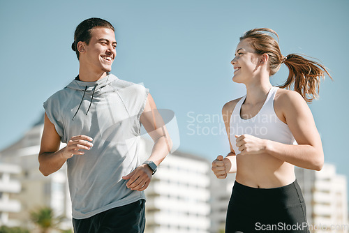 Image of Couple, fitness and smile running in the city for exercise, workout or cardio routine together in Cape Town. Happy man and woman runner taking a walk or jog for healthy wellness or exercising outside