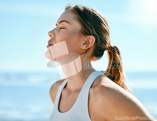 Image of Face, breathing and sweating with an exercise woman outdoor in nature for a cardio or endurance workout. Fitness, breath or sweat and an attractive young female athlete standing with her eyes closed