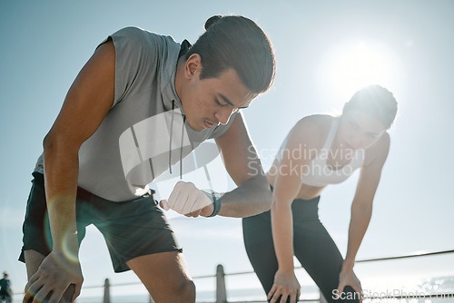 Image of Fitness, tired couple and running time on blue sky for health and wellness outdoor. Man and woman in nature for workout performance and healthy lifestyle for body fatigue with lens flare and progress