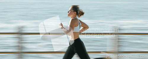 Image of Woman, fitness and speed running by beach on mockup for exercise, workout or cardio routine. Active female runner in fast run, sprint or race by the ocean coast for healthy exercising or wellness