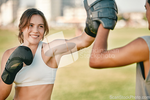 Image of Boxing, woman and personal trainer exercise outdoor in nature park for fitness, health and wellness. Couple of friends happy about sports workout or mma training with motivation, energy and coaching