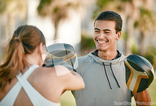 Image of Man, personal trainer and boxing exercise outdoor in nature park for fitness, health and wellness. Couple of friends happy about sports workout or fight training with motivation, energy and coaching