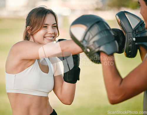Image of Woman, boxing and personal trainer exercise outdoor in nature park for fitness, health and wellness. Couple of friends happy about sports workout or mma training with motivation, energy and coaching