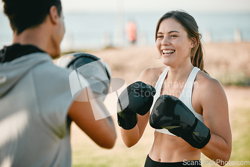 Image of Exercise, happy woman and personal trainer and boxing outdoor at park for fitness, health and wellness. Couple of friends for nature sports workout or fight training with motivation, energy or coach