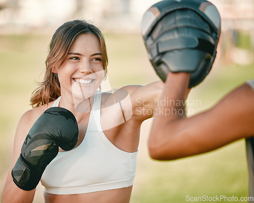 Image of Woman, personal trainer and boxing exercise outdoor in nature park for fitness, health and wellness. Couple of friends happy about sports workout or mma training with motivation, energy and coaching