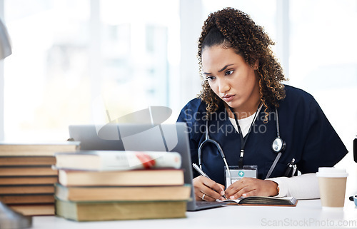 Image of Medical student, laptop or writing books in education research, wellness studying or hospital learning college. Thinking, nurse or healthcare woman with technology in scholarship medicine internship