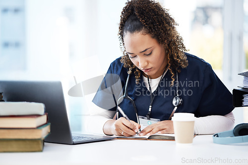 Image of Medical student, laptop or writing books in research education, wellness studying or hospital learning college. Thinking, nurse or healthcare woman with technology in scholarship medicine internship