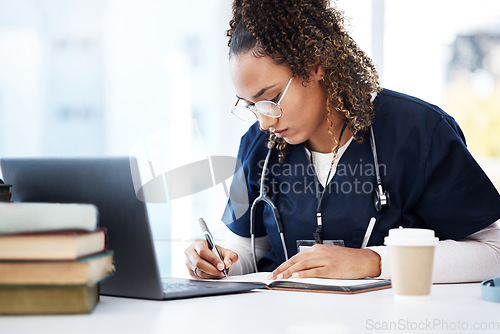 Image of Medical student, thinking or writing books in research education, wellness studying or hospital learning. Laptop, nurse or healthcare woman and notebook, technology or scholarship medicine internship