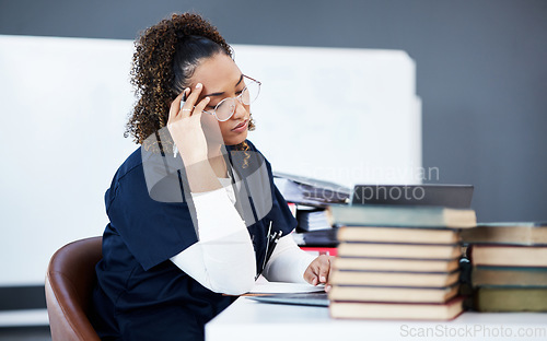 Image of Medical student, tired or stress in hospital research, wellness books studying or education technology learning. Thinking woman, burnout or healthcare nurse anxiety in scholarship medicine internship