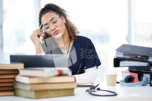 Image of Nurse, tired or stress in hospital education, wellness books study or research laptop learning in medicine scholarship. Thinking, woman or burnout for healthcare worker, student or anxiety internship