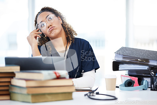 Image of Nurse, thinking or planning in hospital research, wellness books study or laptop education vision in medicine scholarship. Medical student, woman or healthcare ideas for worker technology internship