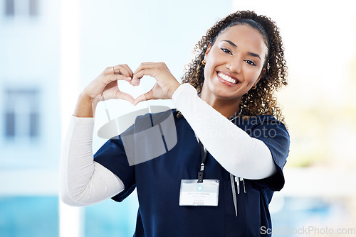 Image of Doctor, portrait or heart hands in hospital wellness, medicine trust or medical support in life insurance, help or vote. Smile, happy or nurse with love gesture in healthcare, emoji or woman security