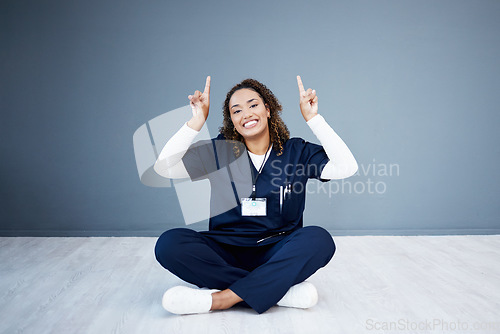 Image of Nurse, portrait or pointing up at hospital promotion, life insurance deal or advertising mockup space. Smile, happy or doctor showing hands at woman healthcare, wellness mock up or volunteer branding