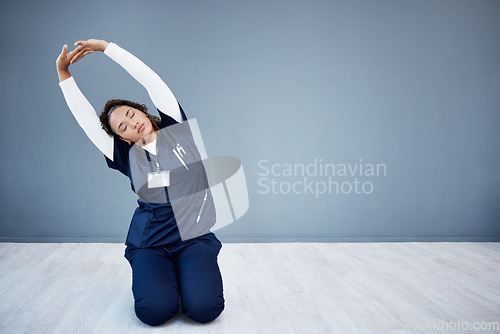 Image of Tired nurse, stretching or arms up on hospital mockup, clinic backdrop or wall mock up in wellness mobility, joint support or healthcare. Doctor, woman or medical physiotherapist and hands in warm up